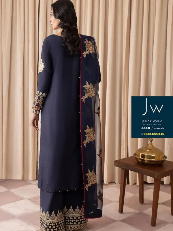Elegant women wearing royal blue color suits from the party wear collection, radiating sophistication and style