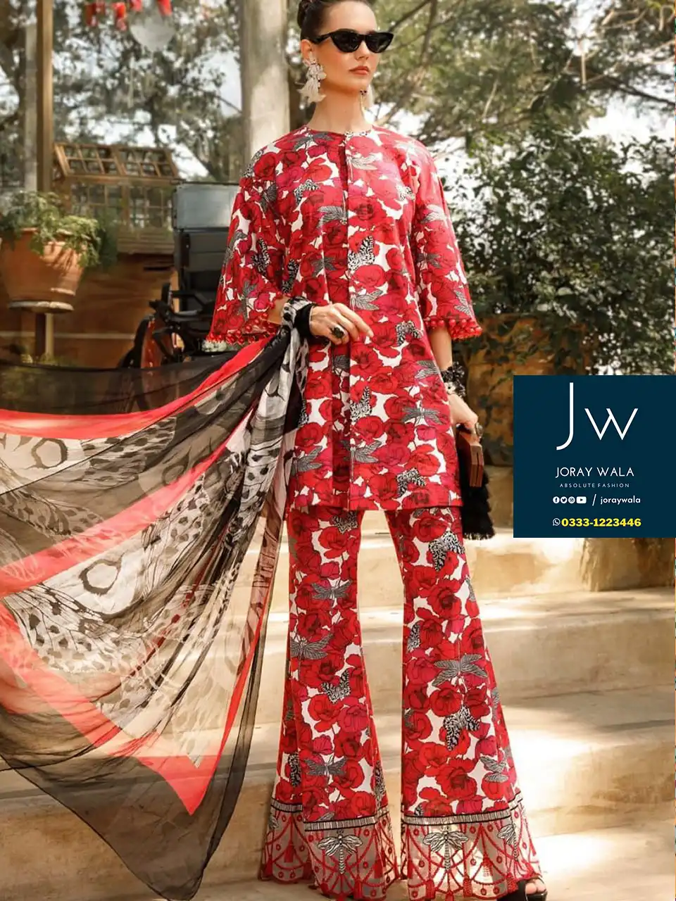 Model wearing Maria b M Print beautiful 3 Pcs lawn suit with floral design, suit has bunch. available at joraywala