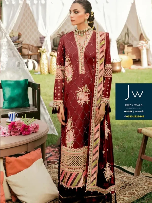 Fancy lawn collection Afrozeh 3 PCS suit model wearing a beautiful Maroon color dress with heavy work and this suit is available at joraywala